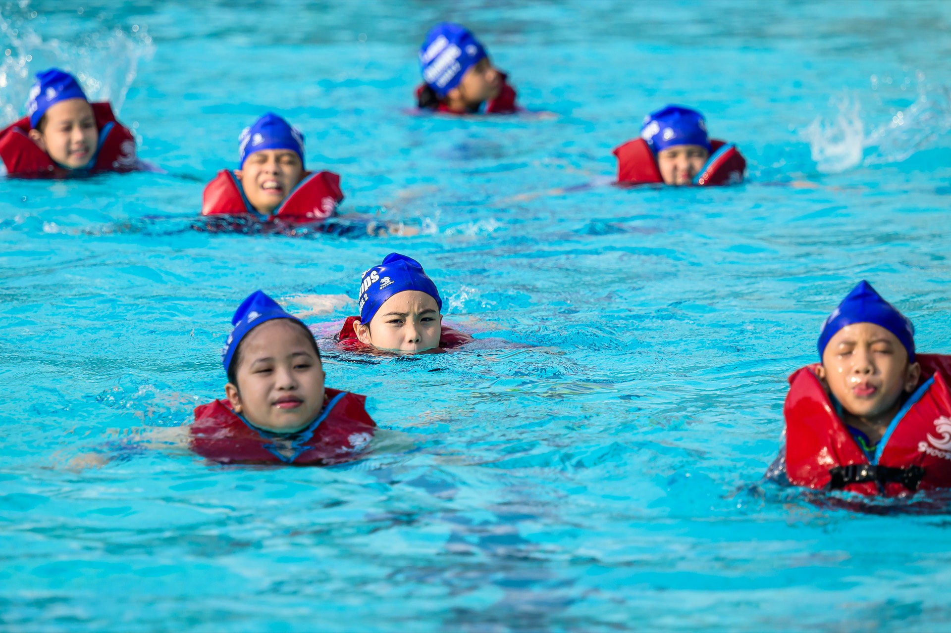 Children swimming at Fitness Champs group lesson