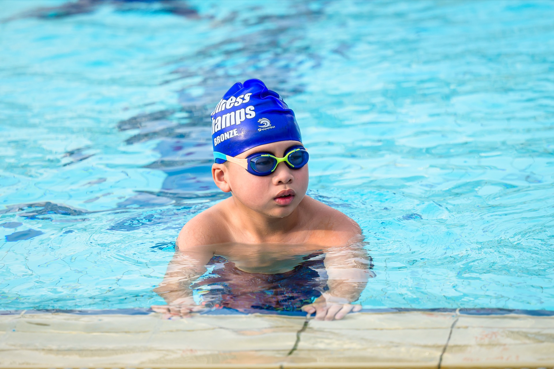 Young swimmer at Fitness Champs swimming lessons in Singapore