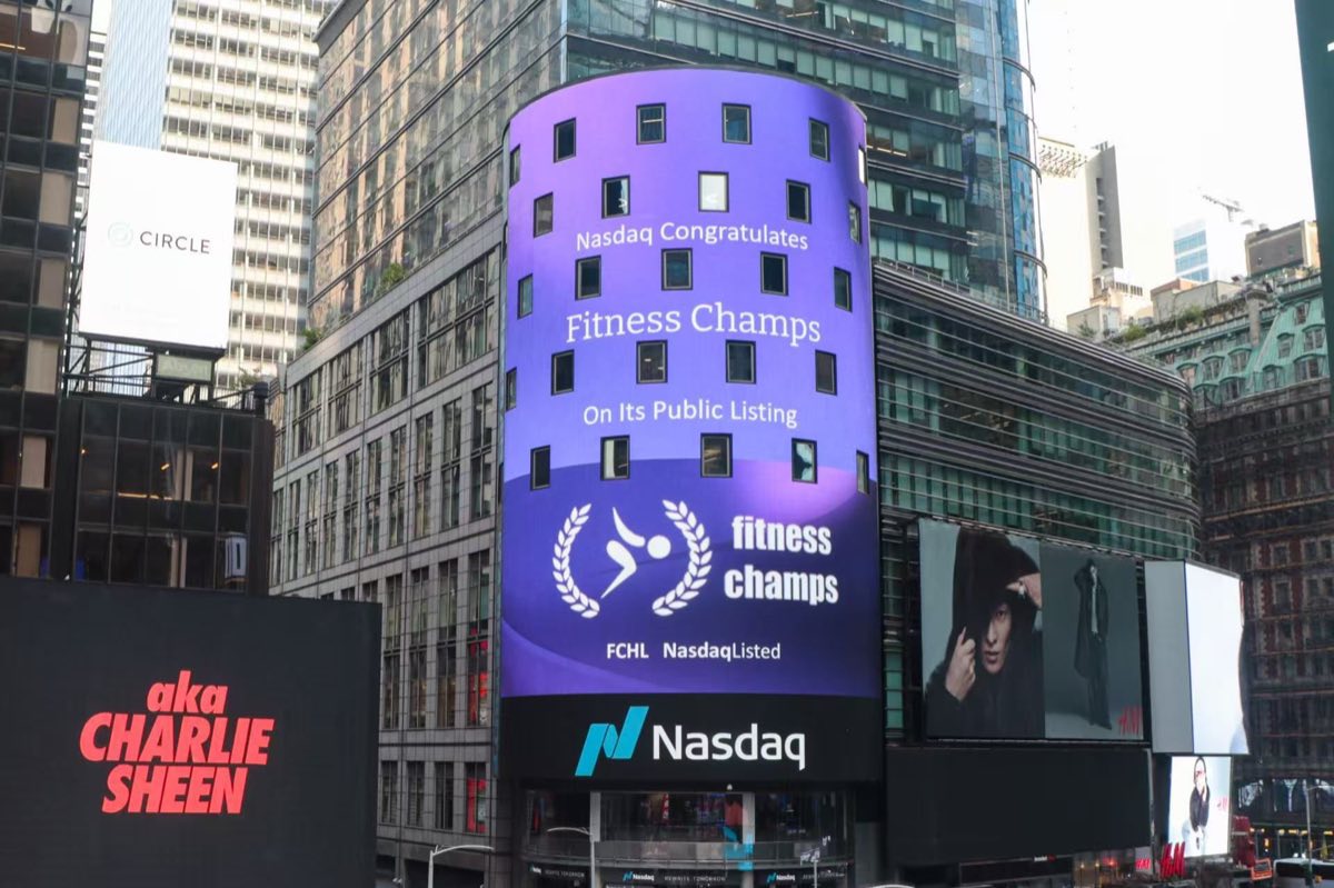 The Nasdaq tower in Times Square showing 'Nasdaq congratulates Fitness Champs on its public listing'